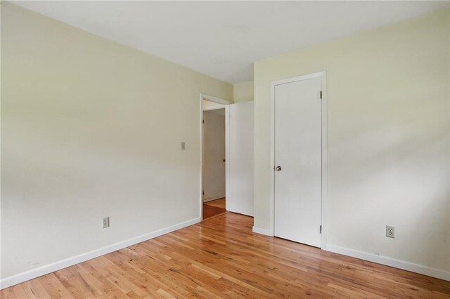 1960 Oak Leaf Ct SW, Marietta, GA 30008 - empty room with light wood finished floors and baseboards