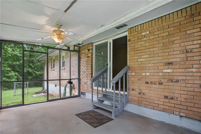 1960 Oak Leaf Ct SW, Marietta, GA 30008 - unfurnished sunroom with entry steps and a ceiling fan