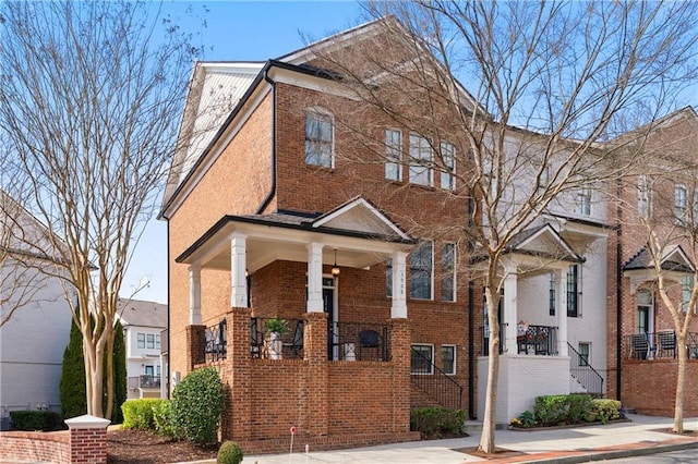 view of property featuring brick siding