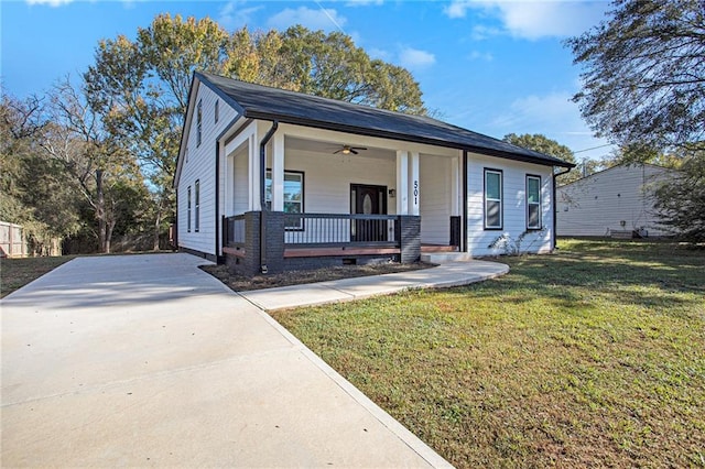 view of front of home with a porch and a front yard