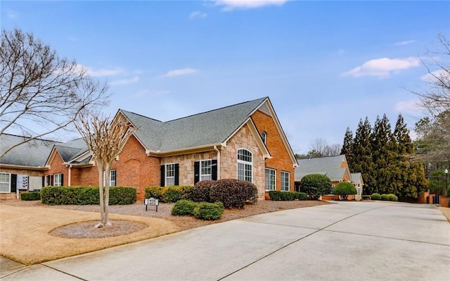 view of front of property with stone siding and brick siding