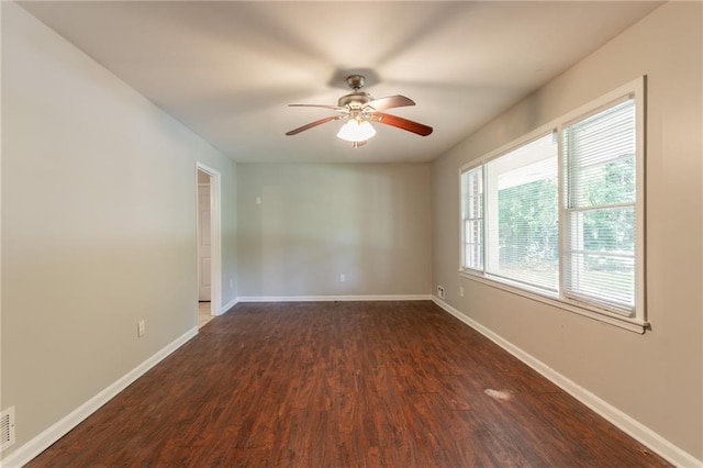 4078 Bouldercrest Rd, Ellenwood, GA 30294 - unfurnished room with ceiling fan, dark wood finished floors, and baseboards