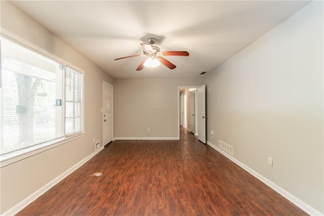 4078 Bouldercrest Rd, Ellenwood, GA 30294 - empty room featuring dark wood finished floors, baseboards, and a ceiling fan