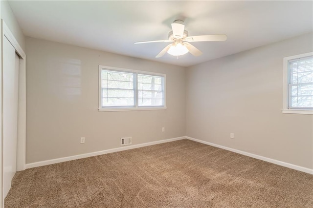 4078 Bouldercrest Rd, Ellenwood, GA 30294 - unfurnished bedroom featuring carpet flooring, multiple windows, and baseboards