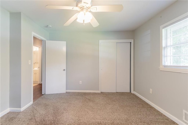 4078 Bouldercrest Rd, Ellenwood, GA 30294 - unfurnished bedroom featuring carpet, a closet, ceiling fan, and baseboards