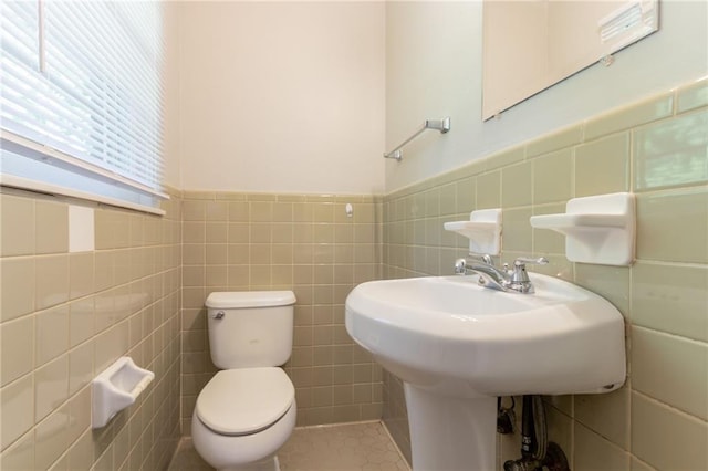 4078 Bouldercrest Rd, Ellenwood, GA 30294 - bathroom with toilet, tile walls, and a wainscoted wall