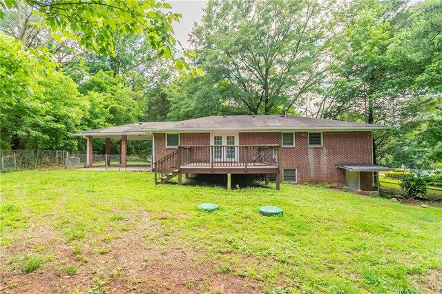 4078 Bouldercrest Rd, Ellenwood, GA 30294 - rear view of house with a wooden deck and brick siding