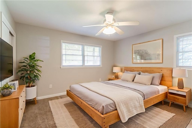 4078 Bouldercrest Rd, Ellenwood, GA 30294 - bedroom featuring multiple windows, light carpet, baseboards, and a ceiling fan