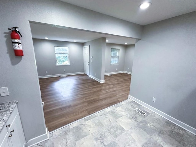 1152 Greenwich St SW, Atlanta, GA 30310 - below grade area featuring wood finished floors, recessed lighting, baseboards, and visible vents