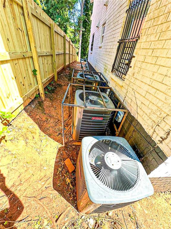 1152 Greenwich St SW, Atlanta, GA 30310 - details with cooling unit and fence