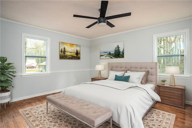 bedroom with multiple windows, ornamental molding, and wood finished floors