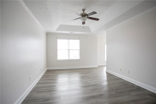 2682 Field Spring Dr, Lithonia, GA 30058 - spare room with a raised ceiling, ceiling fan, a textured ceiling, wood finished floors, and baseboards