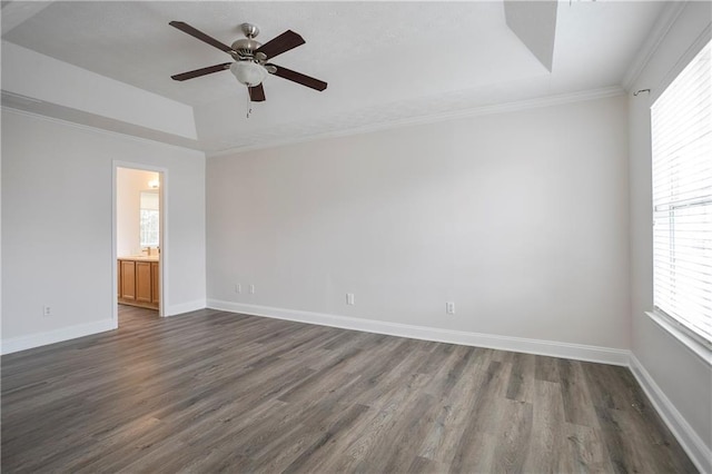 2682 Field Spring Dr, Lithonia, GA 30058 - unfurnished room featuring a tray ceiling, plenty of natural light, dark wood-style floors, ceiling fan, and ornamental molding