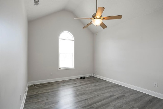 2682 Field Spring Dr, Lithonia, GA 30058 - spare room with lofted ceiling, ceiling fan, wood finished floors, and baseboards