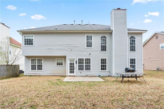 2682 Field Spring Dr, Lithonia, GA 30058 - back of property with a patio area and a chimney