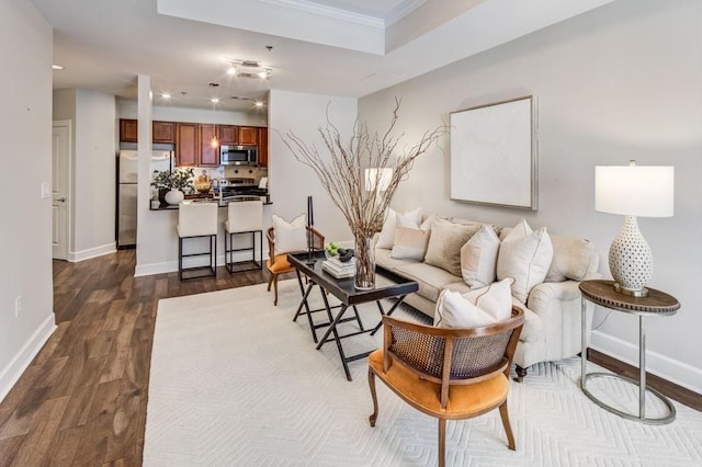 325 E Paces Ferry Rd NE Unit 410, Atlanta, GA 30305 - living room featuring dark wood-style flooring, baseboards, recessed lighting, and ornamental molding
