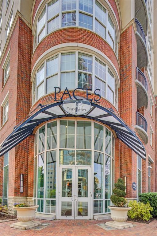 325 E Paces Ferry Rd NE Unit 410, Atlanta, GA 30305 - doorway to property with french doors and brick siding