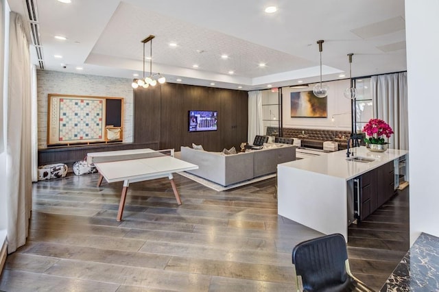325 E Paces Ferry Rd NE Unit 410, Atlanta, GA 30305 - living area featuring wood finished floors, a tray ceiling, and recessed lighting