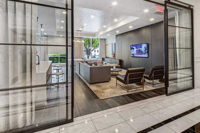 325 E Paces Ferry Rd NE Unit 410, Atlanta, GA 30305 - lobby with recessed lighting and a wall of windows