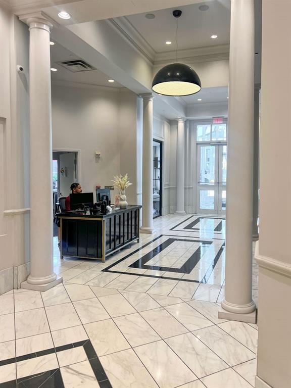 325 E Paces Ferry Rd NE Unit 410, Atlanta, GA 30305 - common area with ornamental molding and recessed lighting