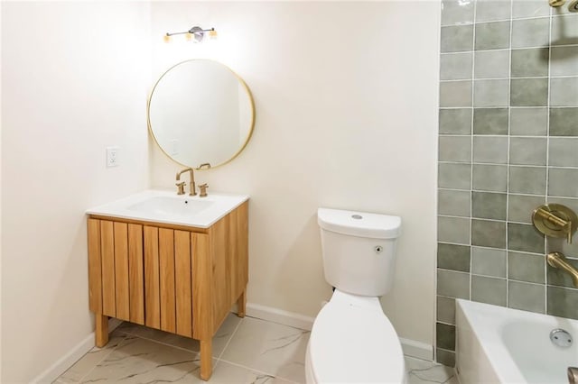 bathroom featuring marble finish floor, bathing tub / shower combination, toilet, vanity, and baseboards