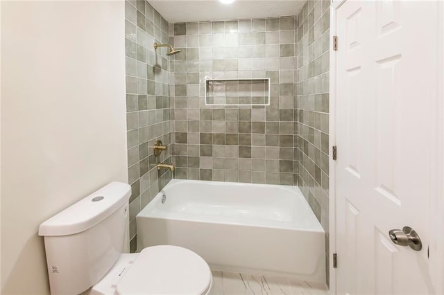 full bathroom with washtub / shower combination and toilet