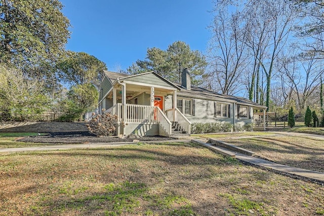 view of front of home with a porch and a front lawn