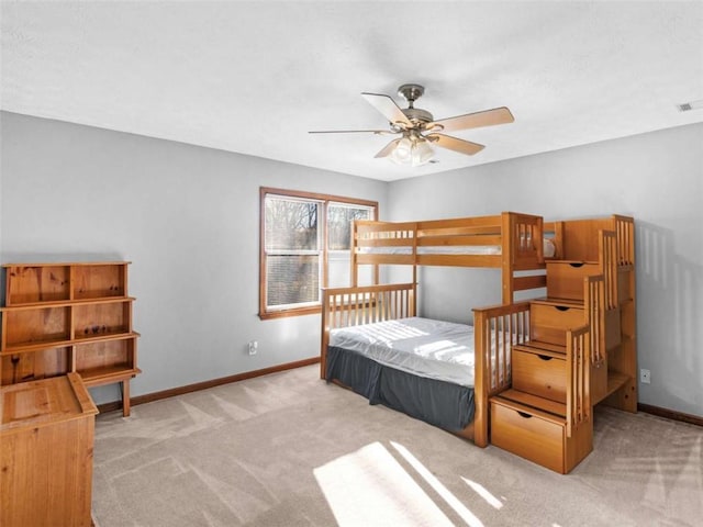 carpeted bedroom featuring visible vents and baseboards