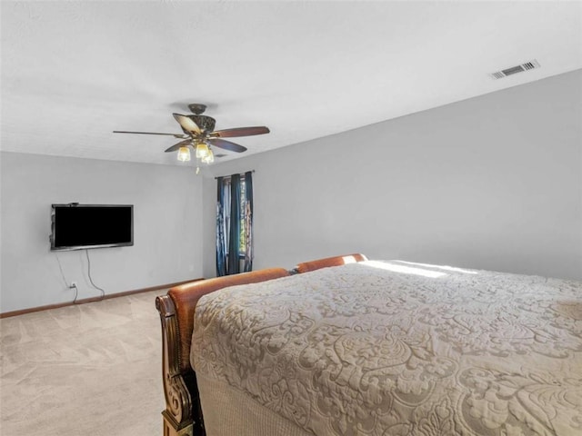 bedroom with visible vents, a ceiling fan, baseboards, and carpet floors