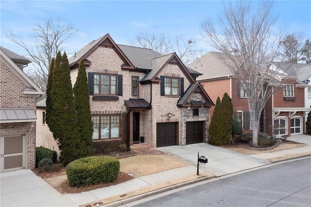 view of front of house featuring a garage, concrete driveway, stone siding, roof with shingles, and brick siding