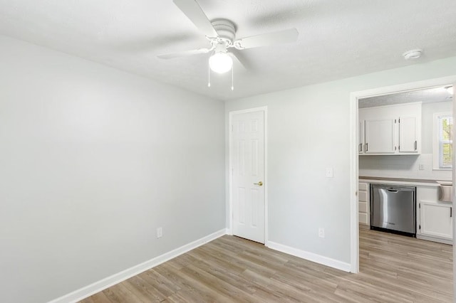 unfurnished room with ceiling fan and light hardwood / wood-style flooring