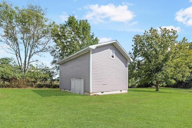 view of side of property with a yard