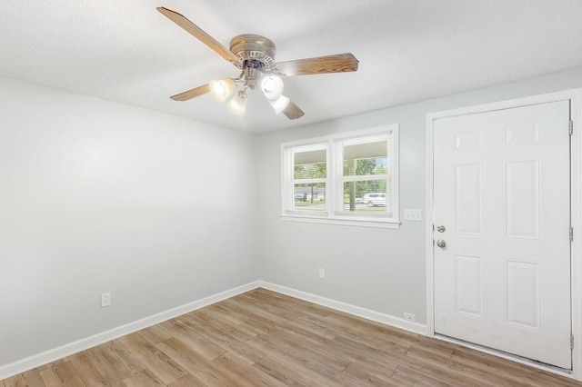 unfurnished room featuring ceiling fan and light hardwood / wood-style flooring