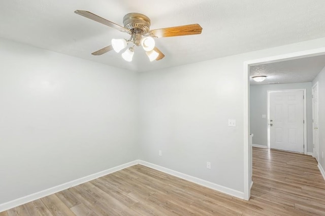 unfurnished room with ceiling fan and light hardwood / wood-style floors