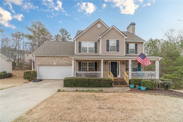 view of front facade with driveway, a porch, an attached garage, brick siding, and a chimney