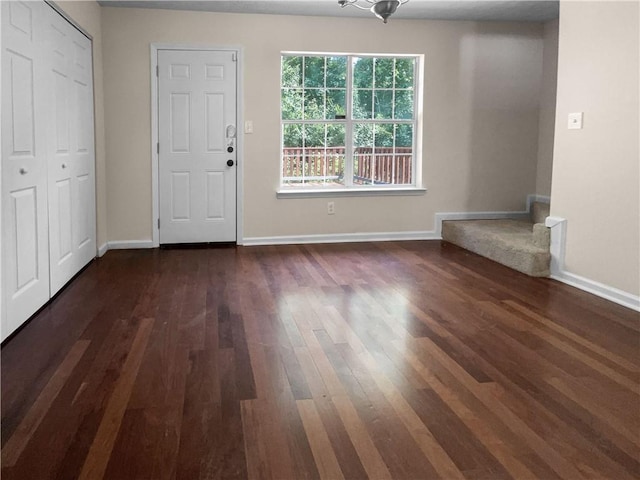 entrance foyer with dark hardwood / wood-style flooring