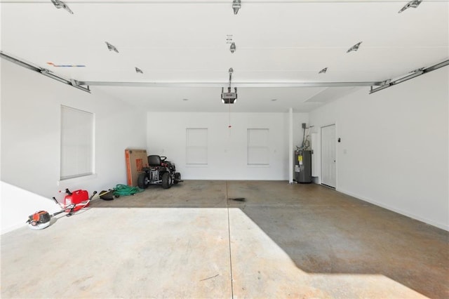 garage with electric water heater and a garage door opener