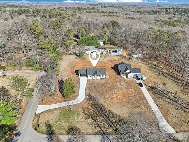 bird's eye view featuring a view of trees