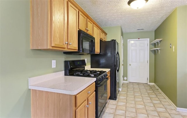 3971 Canebrake Ln, Douglasville, GA 30134 - kitchen with black appliances, light countertops, baseboards, a textured ceiling, and brown cabinetry