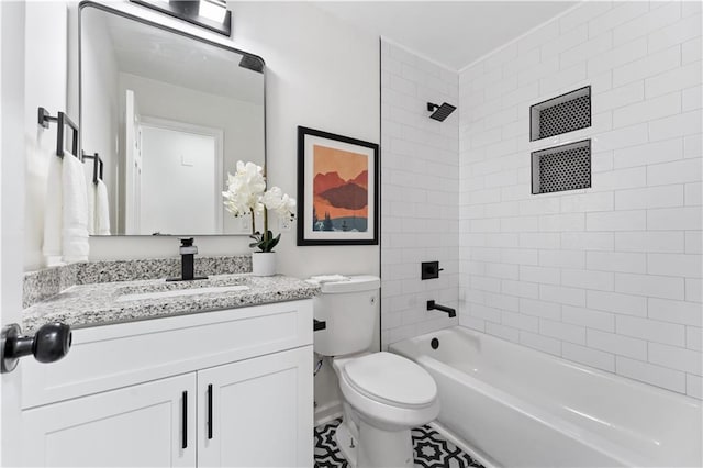 full bathroom featuring vanity, toilet, and tiled shower / bath