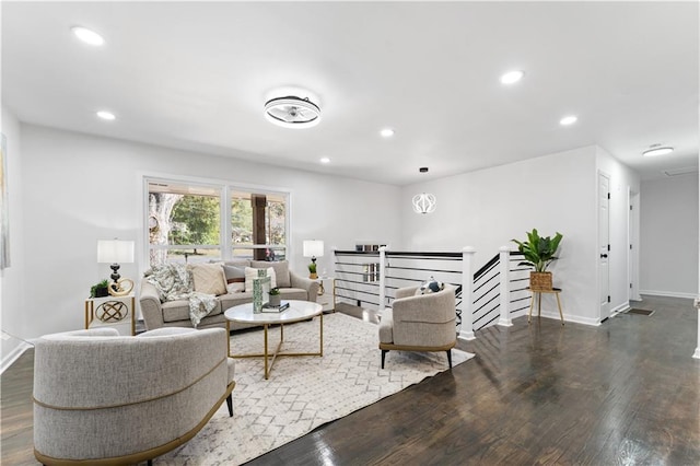 living room featuring dark wood-type flooring