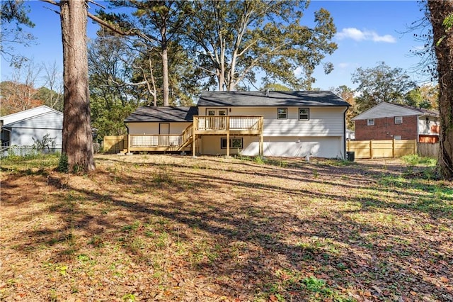 rear view of house with a wooden deck