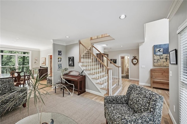 stairs with wood finished floors, ornamental molding, baseboards, and recessed lighting