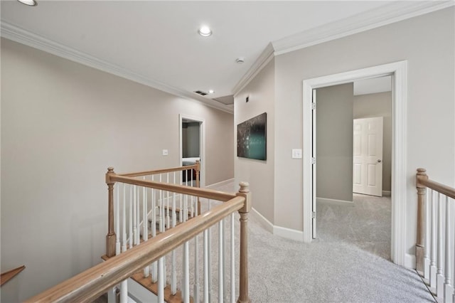 hallway with an upstairs landing, ornamental molding, recessed lighting, carpet flooring, and baseboards