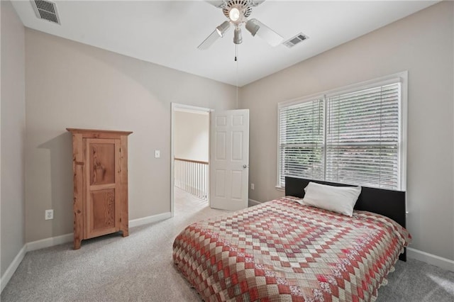 carpeted bedroom with baseboards and a ceiling fan