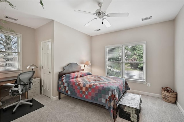 bedroom with carpet floors, a desk, baseboards, and a ceiling fan