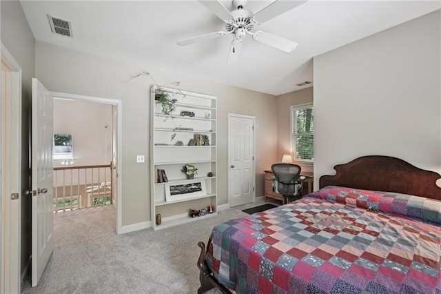 carpeted bedroom featuring ceiling fan and baseboards