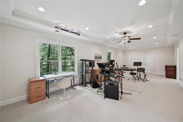 home office featuring a raised ceiling, recessed lighting, light carpet, and healthy amount of natural light