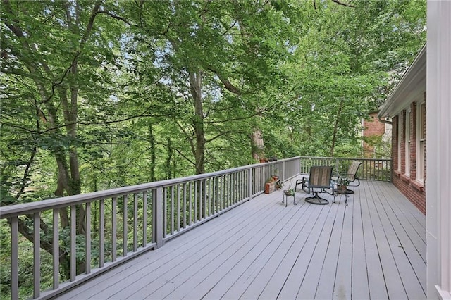 wooden deck featuring outdoor dining space
