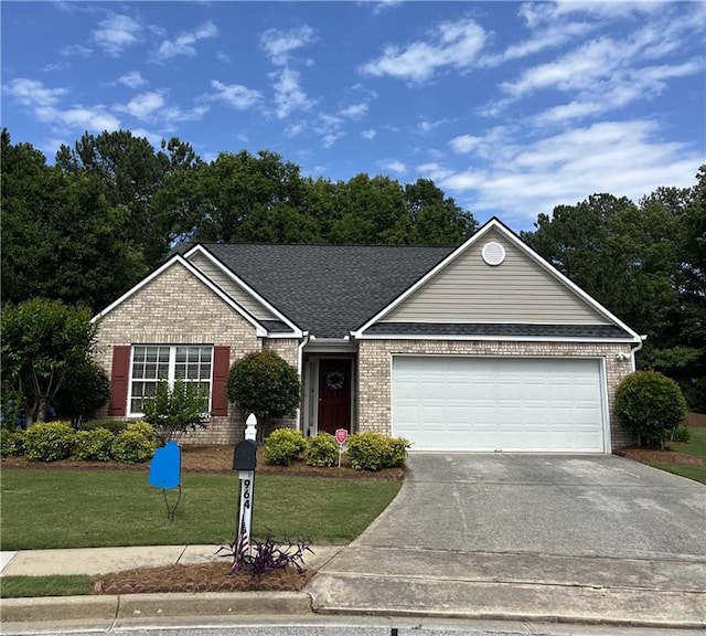 964 Village View Cir, Loganville, GA 30052 - single story home with brick siding, an attached garage, driveway, a front yard, and roof with shingles